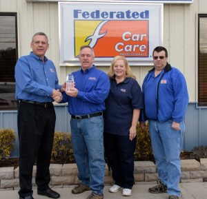 From left to right: Phil Moore, Federated Auto Parts; Tim Smith and Kim Smith, owners, American & Import Auto Repair; and Kevin Andrade, Fisher Auto Parts.